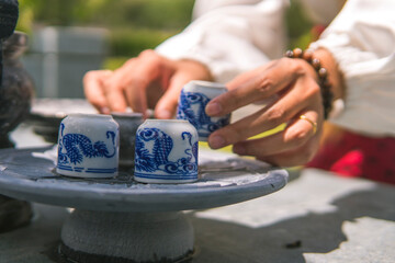 Praying and sacrificial offering food and joss paper to ancestors in the Qingming Festival or Tomb Sweeping day