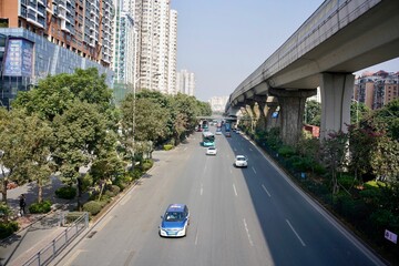 Shenzhen, Guangdong Province, China - 28 December 2019: Landscape of the road in town with some cars moving.