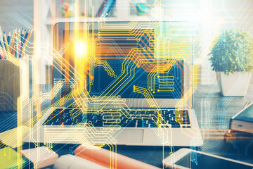 Double exposure of desktop with computer and world map hologram. International data network concept.