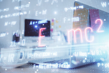 Desktop computer background and formula hologram writing. Double exposure. Education concept.