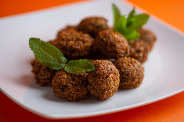 Falafel , middle eastern deep fried chickpea balls with french fries 