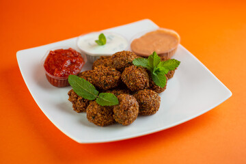 Falafel , middle eastern deep fried chickpea balls with french fries 