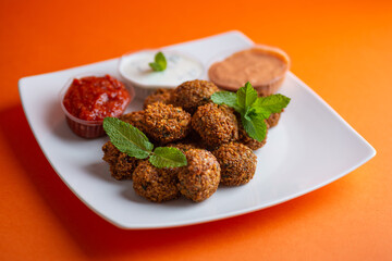 Falafel , middle eastern deep fried chickpea balls with french fries 