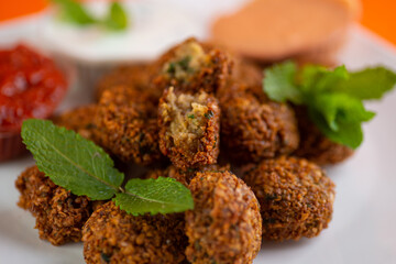 Falafel , middle eastern deep fried chickpea balls with french fries 