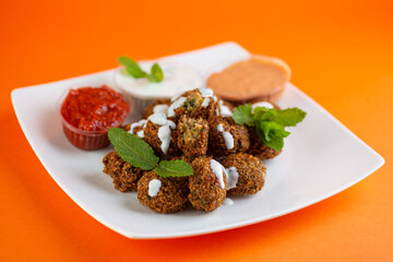 Falafel , middle eastern deep fried chickpea balls with french fries 