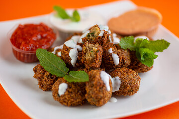 Falafel , middle eastern deep fried chickpea balls with french fries 