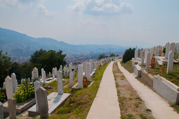 Martyrs’ Cemetery Kovaci:
White graves of the muslim graveyard on the hill above the city. Total number of deaths during the Bosnian War (1992-1995) was 110,000 people
