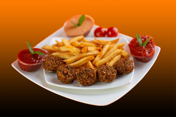 Falafel , middle eastern deep fried chickpea balls with french fries 