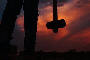Silhouette of man holding hammer