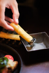 Filo and cheese cigars with charcoal aioli 