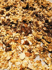 hot homemade granola muesli with chocolate closeup background texture