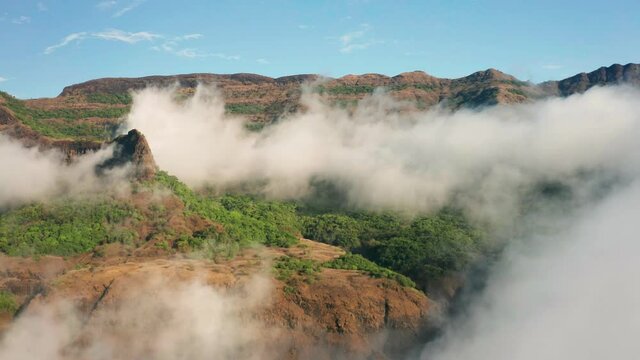 Cloud Nine , Awesome forwards drone shot passing through the fog clouds revealing a beautiful view of the mountains of Western Ghats
