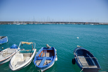 Fototapeta na wymiar view to marina with sailboats from marina with fisher boats