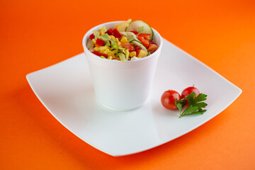A close-up of a rustic Greek salad with feta cheese