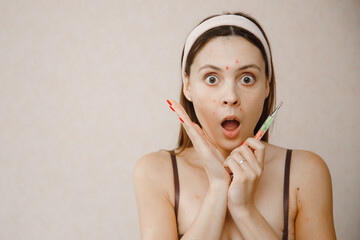Portrait young woman with chickenpox lying in bed and measuring temperature