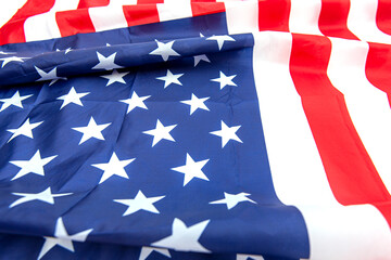 Natural fabric crumpled USA flag, rag American flag top view as texture or background, high resolution picture