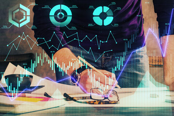 Double exposure of man writing on paper with forex graph.