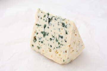 cheese containing veins of blue mold, such as Gorgonzola and Danish Blue.