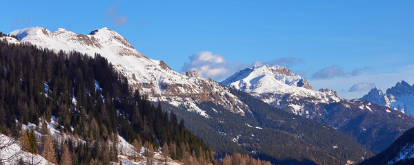 Panoramic landscape of the winter mountain at sunset time in the Dolomites Alps in Italy.