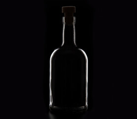 highlight whiskey bottle isolated on black background.