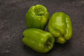 Three green bell juicy peppers