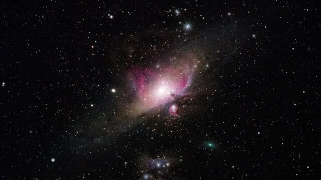 Flying through space and nebula while the galaxy, stars and the milky way are moving towards the viewer in outerspace.