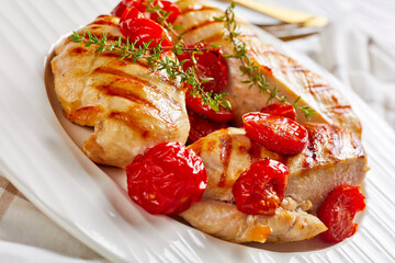 hot spicy grilled chicken breasts and tomatoes