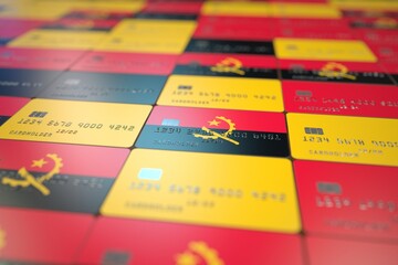 National flag of Angola on credit cards. Banking related 3D rendering