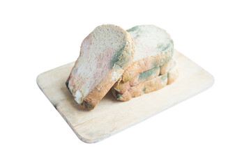 Obraz premium Moldy Whole wheat bread loaf on cutting board over white background.