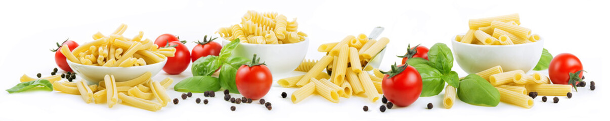 Four formats of artisanal durum wheat pasta: casarecce, tortiglioni, penne rigate and sedani rigati isolated on a white background with cherry tomatoes, basil and peppercorns.