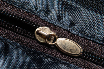 Close Up or macro shot of zipper on fabric clothing.