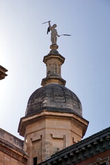 Statue atop the corner pillar of the Santa Maria de la Encarnacion Cathedral Granada Granada Province Andalusia Spain Western Europe.