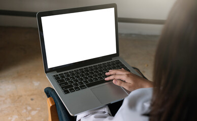 young woman working with laptop computer at home, empty screen display