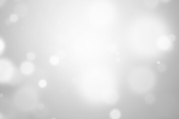 Bokeh abstract blurred silver and white beautiful background. Soft color light glitter sparkles. element for backdrop or design cosmetic ads, winter, christmas, luxury, beauty, baby, modern, creative