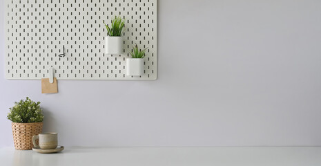 A comfortable workspace is surrounding by office equipment.