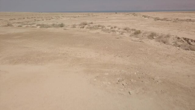 Amazing view of the Israelian desert stone sands shot from the Dead Sea. High quality 4k footage.