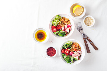 Fresh salad with couscous, tomatoes, cucumber, radish and chard.