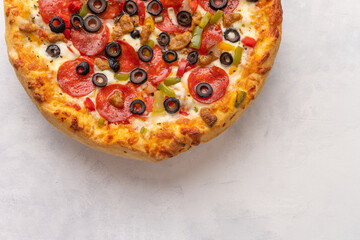 Italian pizza margherita on a light background, bannerTop view of italian rustic pizza with salami, olives, tomatoes, cheese.See how Prosciutto, Capricciosa, Fungi, Cotto Pizza.
