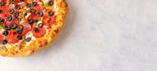 Hot true PEPPERONI ITALIAN PIZZA with salami and cheese. TOP VIEW Delicious traditional pepperoni pizza on a wooden white table .BANNER, for logo or advertising