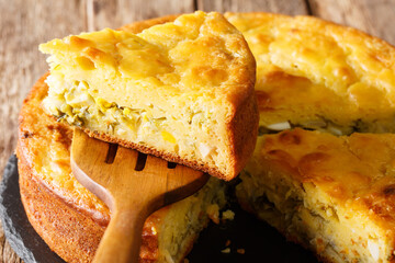 Russian pie with cabbage, herbs and boiled eggs close-up. horizontal