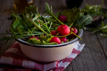 Fresh ingredients for vegetable salad, radish, arugula and lettuce
