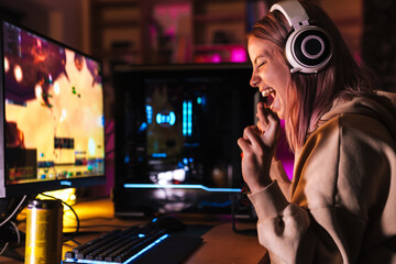 Image of girl holding fingers crossed while playing video game