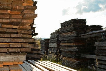 Stack of wood in a sawmill - storage of wooden boards