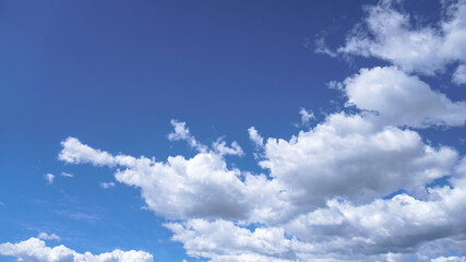 Picturesque clouds in the sky. Window view of an airplane on a sunny gloomy day. Stock photo background