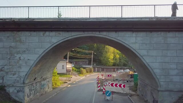 Old viaduct. Old bridge. Cars and people passing the viaduct. Kaunas city, Lithuania.