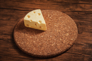 piece of Cheese and Cheddar Cheese grated on old vintage Cooking wooden table. Cheese background Texture and Copy space