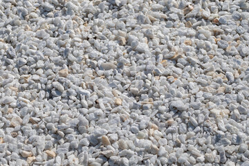 Background of small stones. Texture of marble stones.