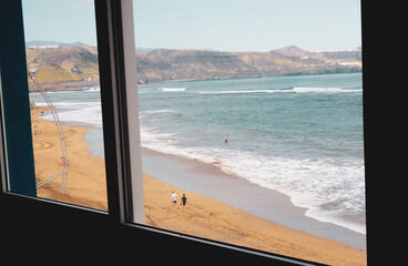 window with views of beach and sea