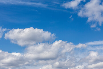Naklejka na ściany i meble beautiful clouds on a blue sky. Natural background and texture