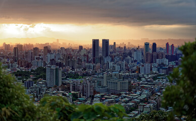 Fototapeta na wymiar Dark Taipei cityscape viewed from a nearby mountain in the late afternoon